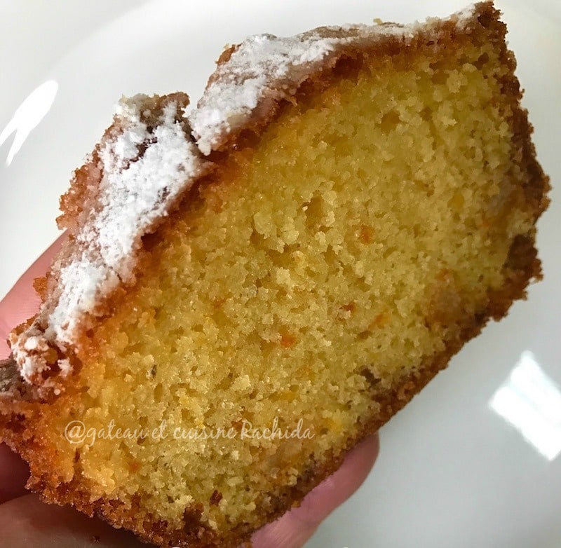 A slice of very moist orange cake, with a melting, fragrant texture.